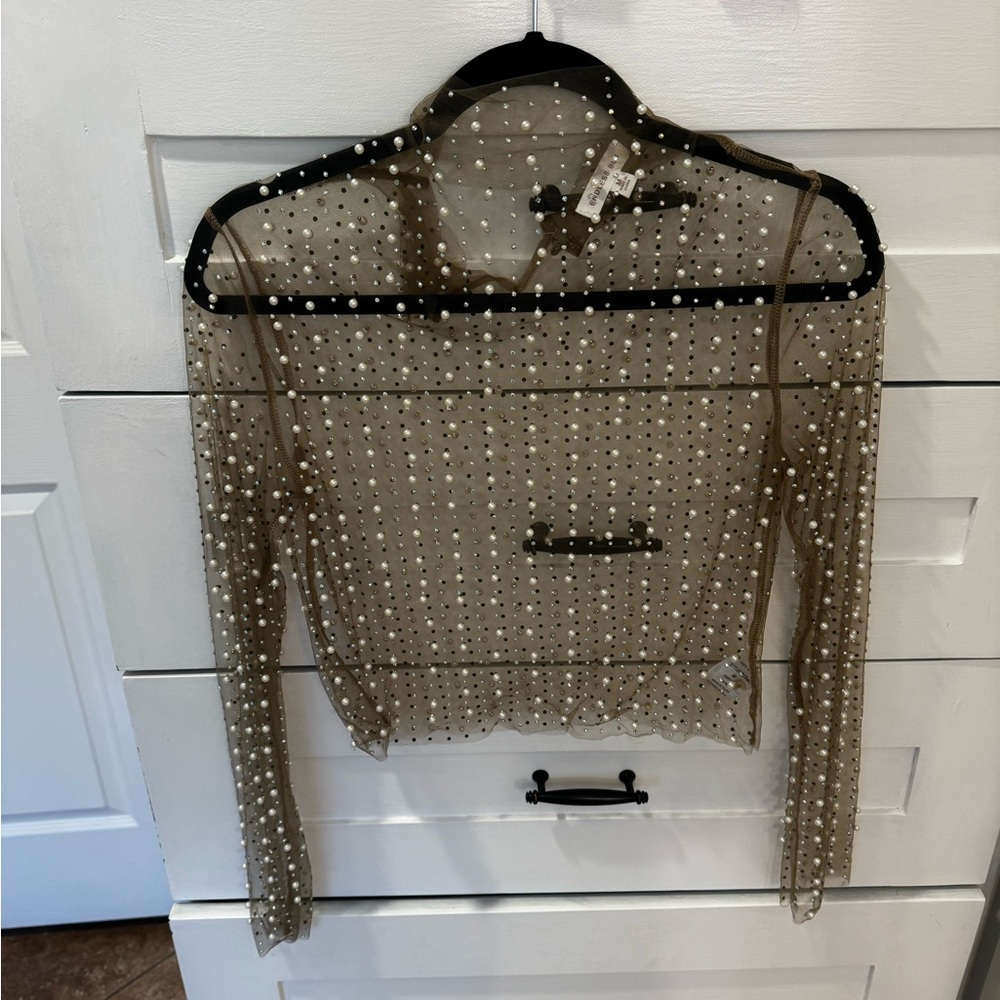 Adorable new embellished top!  Cute paired with a tank and jeans or dressed up!